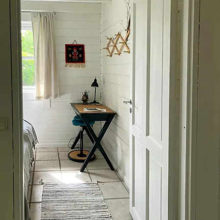 Summer House With Path To Pier By Fjord